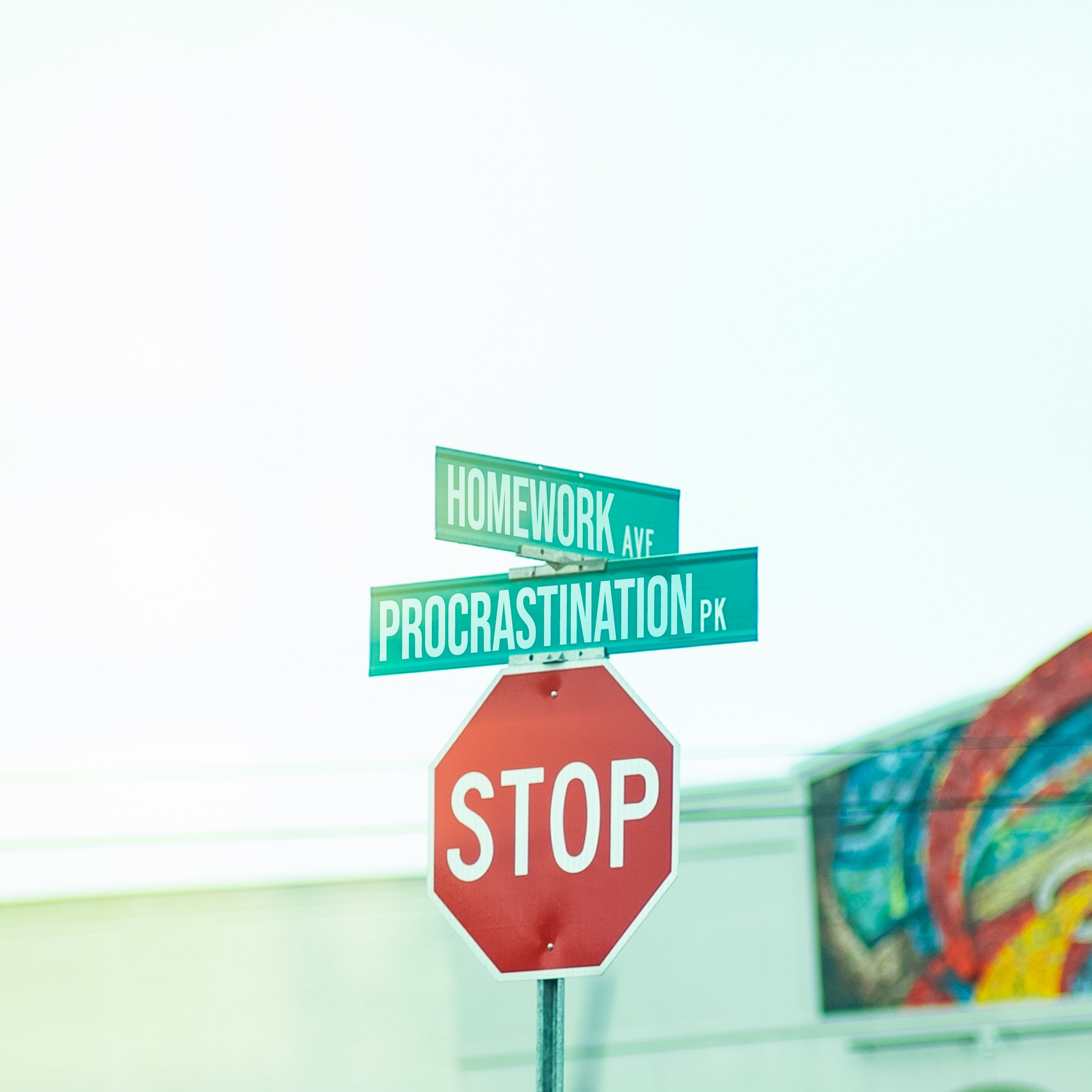 Stop sign with photoshoped street names: 'Homework Ave' and 'Procrastination Pk'.